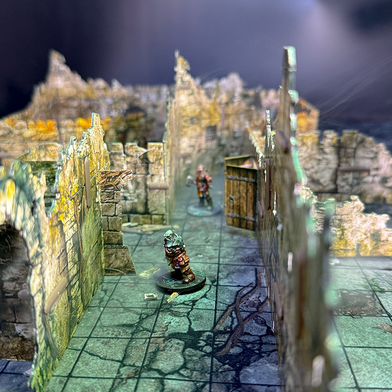 Two adventurers explore the kobold lair, created using 3D terrain  and inspired by the Cave A of the Caves of Chaos quest from the Heroes of the Borderlands D&D starter set.
