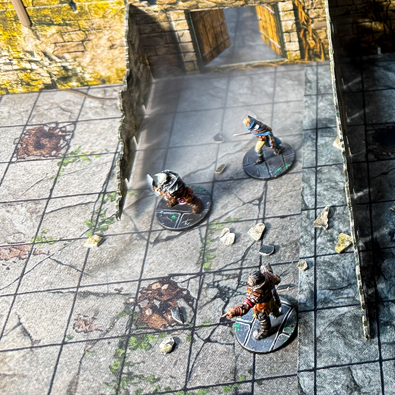 Three adventurers prepare to enter the kobold lair, created using 3D terrain  and inspired by the Cave A of the Caves of Chaos quest from the Heroes of the Borderlands D&D starter set.