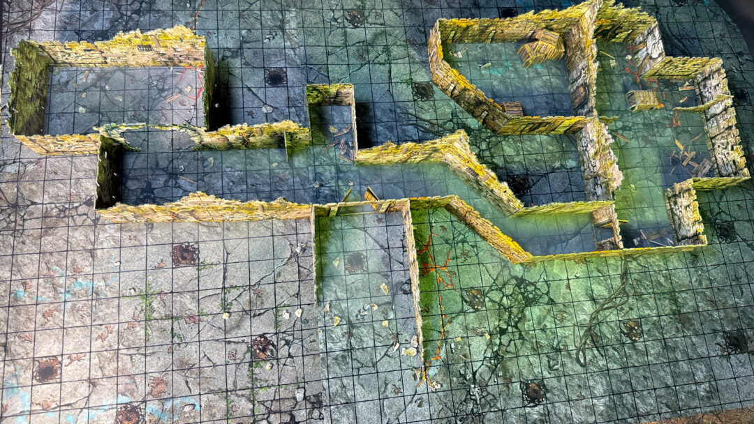 Top down view of the kobold lair, created using 3D terrain and inspired by the Cave A of the Caves of Chaos quest from the Heroes of the Borderlands D&D starter set.