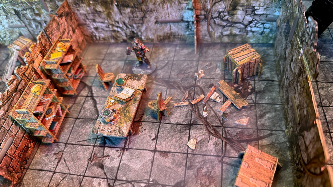 A warrior explores the library in the nothic lair, created using 3D terrain and inspired by the Cave C of the Caves of Chaos quest from the Heroes of the Borderlands D&D starter set.