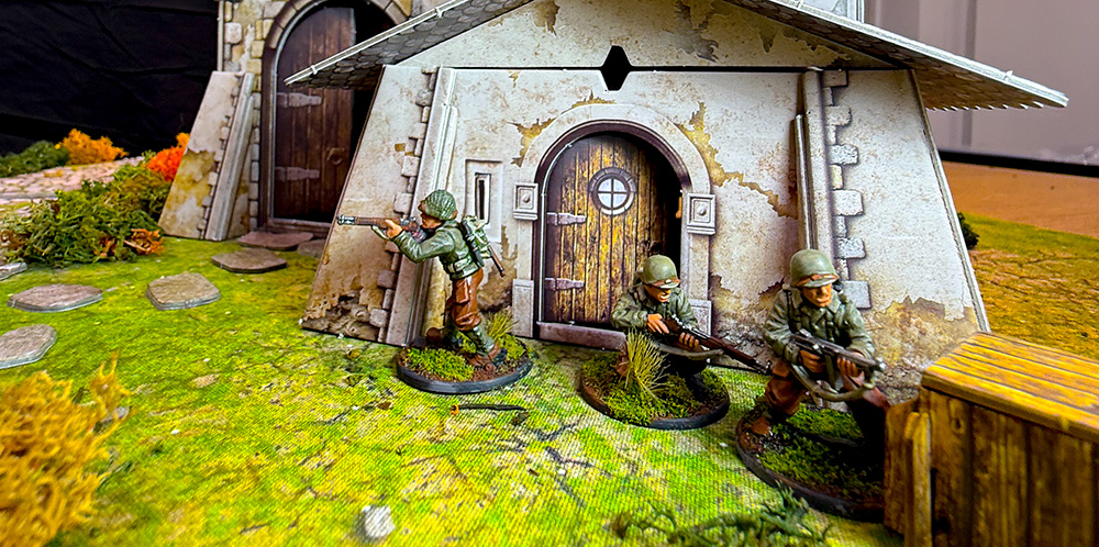 Bolt Action US Rangers take cover in front of the Battle Systems fantasy Chapel terrain.